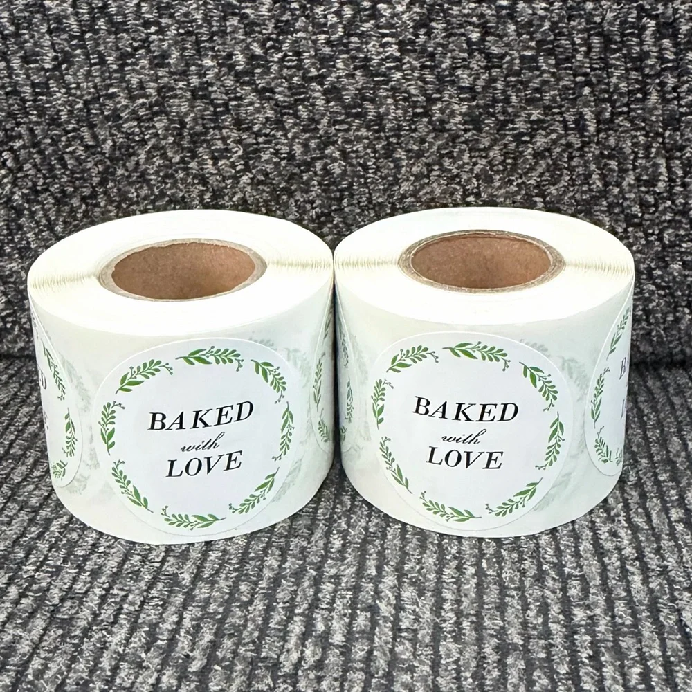 2 rolls of stickers “baked with love” 1.5in